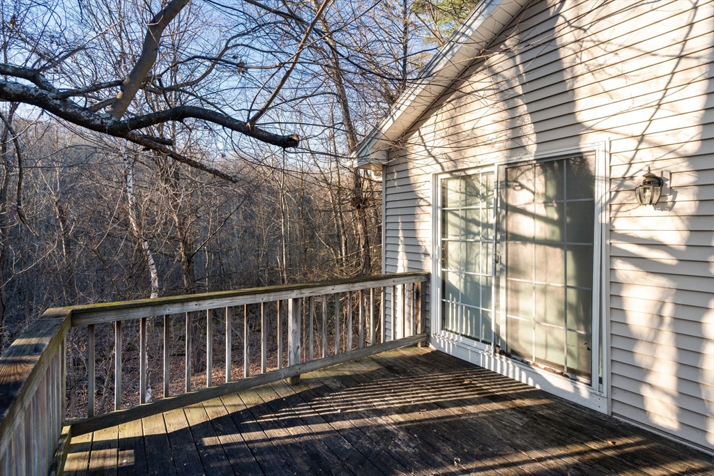 89 Jarvis Avenue Holyoke, MA 01040 - Photo 5 of 27 a view of a wooden balcony next to a yard