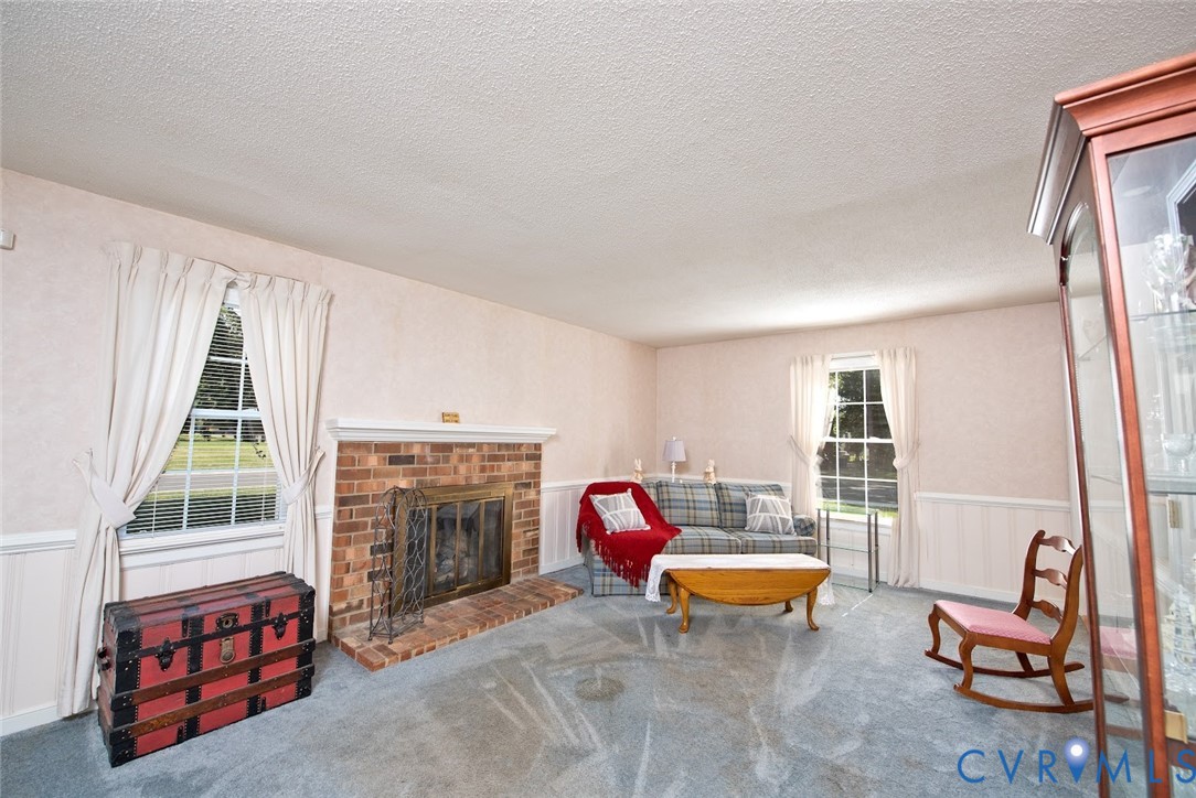 2308 Pleasant Run Drive Henrico, VA 23238 - Photo 11 of 33 Living area featuring wainscoting, a fireplace, ca