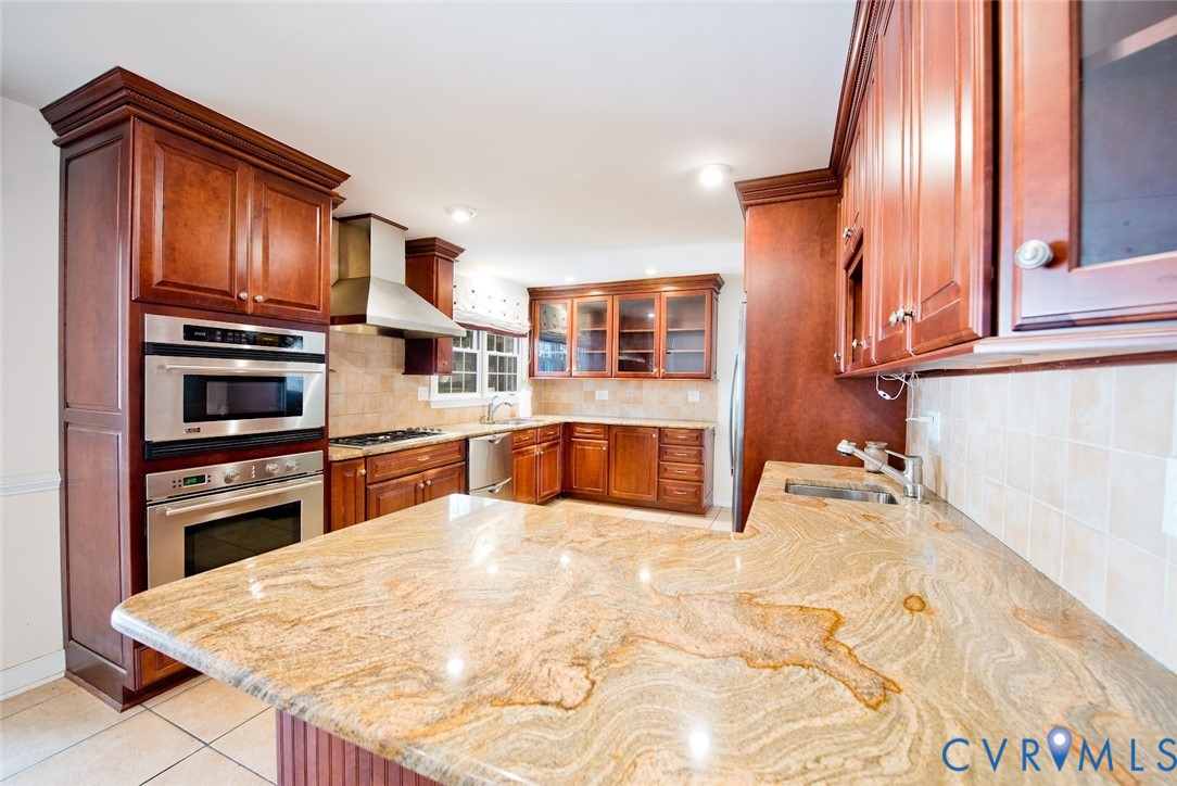 2308 Pleasant Run Drive Henrico, VA 23238 - Photo 12 of 33 Kitchen with glass insert cabinets, decorative bac