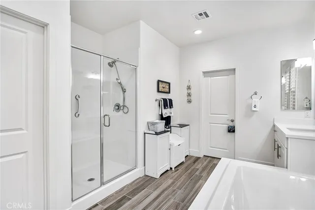 a spacious bedroom with a bed and a table