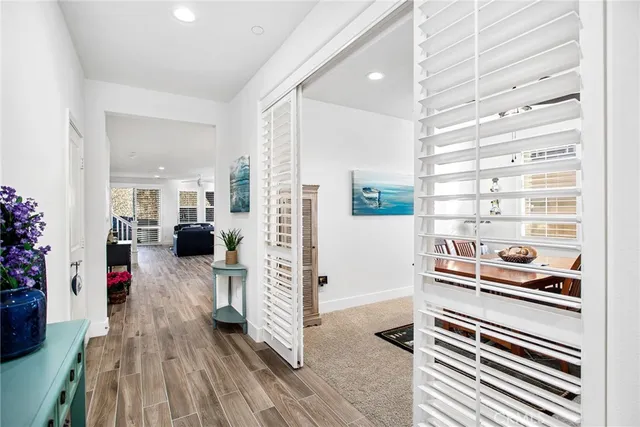 a kitchen with stainless steel appliances granite countertop white cabinets and a sink