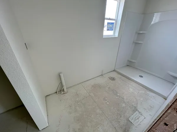 a kitchen with a sink and living room