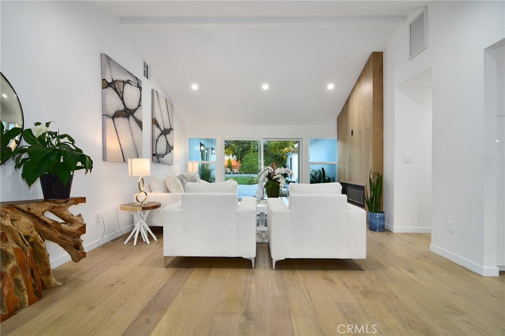 6118 Longridge Avenue Valley Glen, CA 91401 - Photo 13 of 42 a living room with furniture and a potted plant
