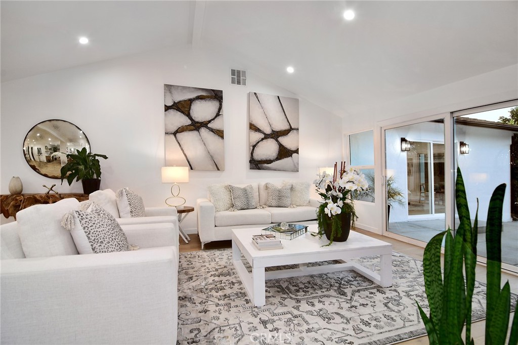 6118 Longridge Avenue Valley Glen, CA 91401 - Photo 16 of 42 a living room with furniture a rug and wooden floor