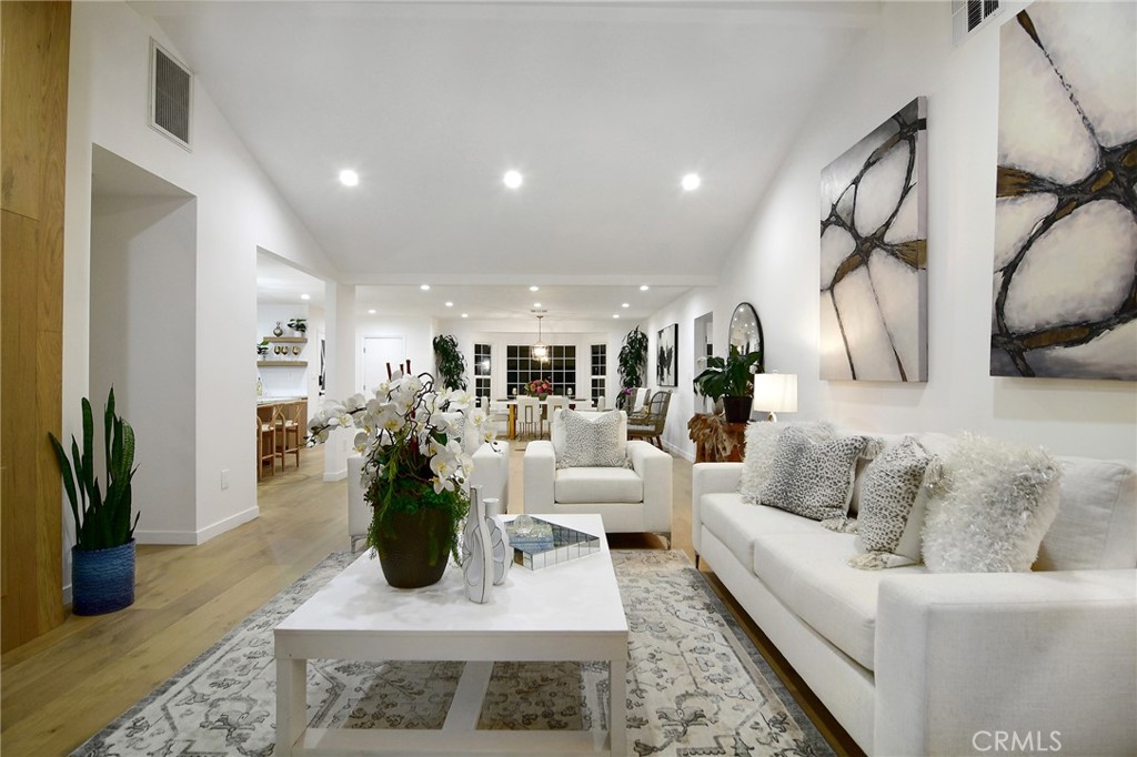 6118 Longridge Avenue Valley Glen, CA 91401 - Photo 17 of 42 a living room with furniture rug and wooden floor