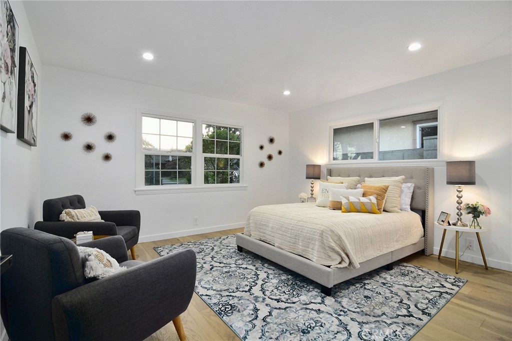 6118 Longridge Avenue Valley Glen, CA 91401 - Photo 20 of 42 a bedroom with a bed and a couch