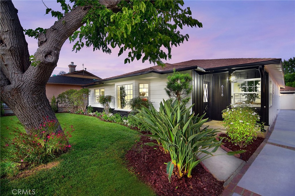6118 Longridge Avenue Valley Glen, CA 91401 - Photo 2 of 42 a front view of a house with a yard