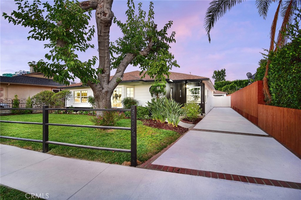 6118 Longridge Avenue Valley Glen, CA 91401 - Photo 3 of 42 a view of a house with a big yard plants and large trees