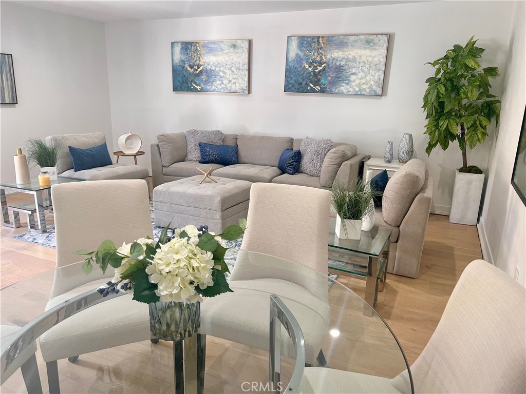 6118 Longridge Avenue Valley Glen, CA 91401 - Photo 41 of 42 a living room with furniture flowerpot and wooden floor