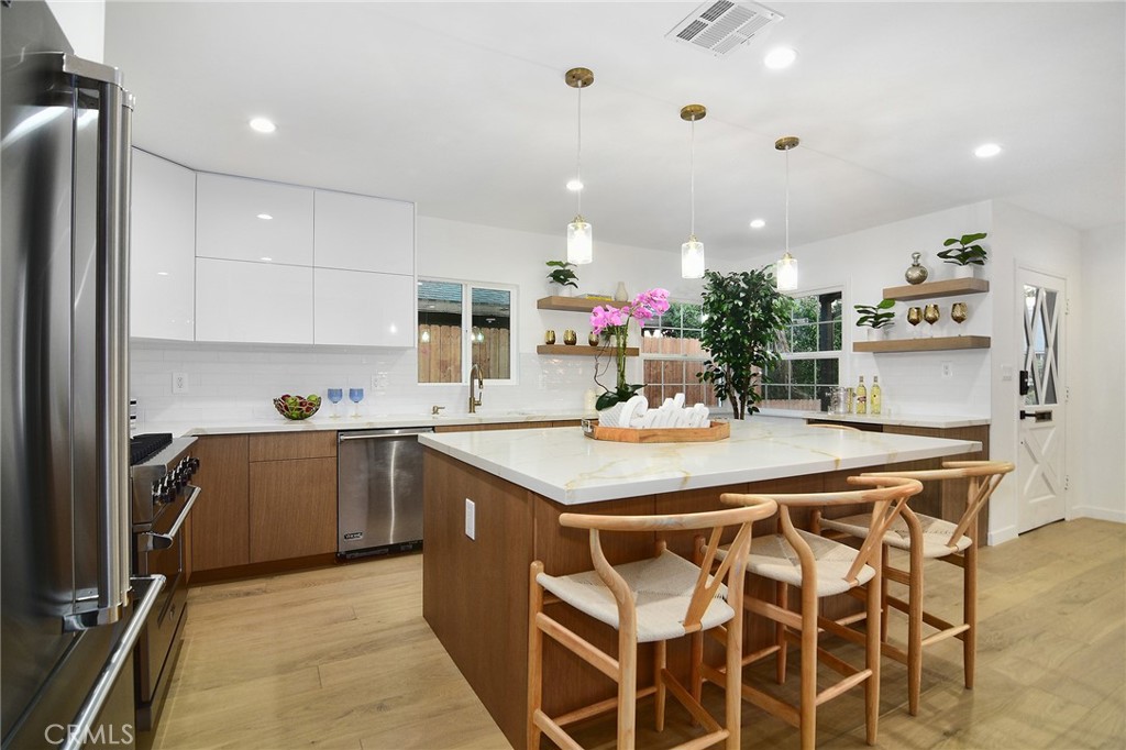6118 Longridge Avenue Valley Glen, CA 91401 - Photo 6 of 42 a kitchen with a sink and cabinets