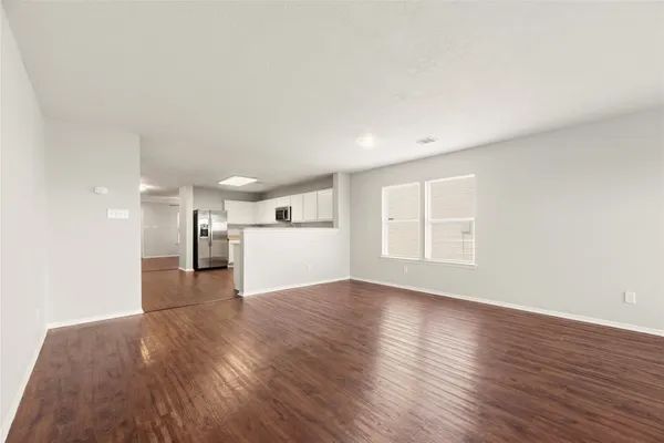 a view of a livingroom with wooden floor