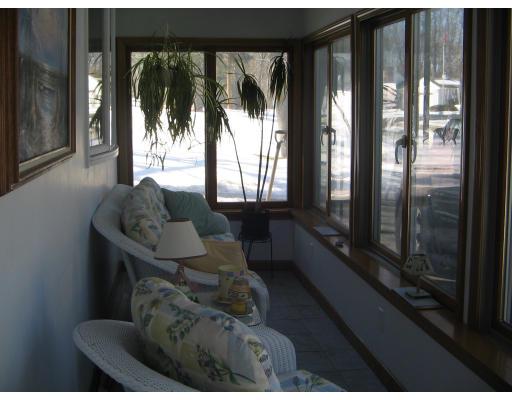 1 Taylor Road Maynard, MA 01754 - Photo 8 of 18 a living room with furniture and a floor to ceiling window