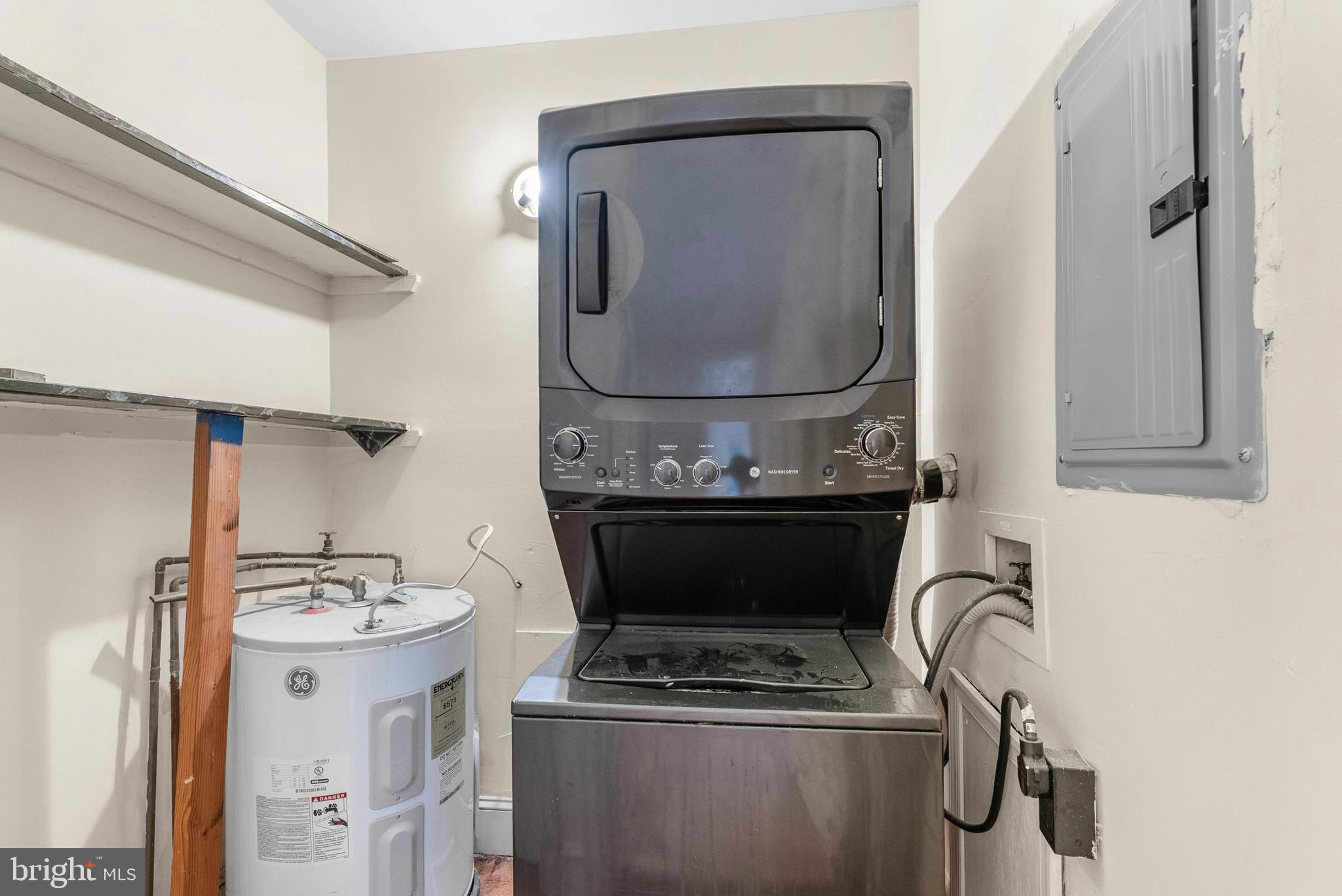 2024 Spring Garden Street, Unit 4 Philadelphia, PA 19130 - Photo 12 of 28 a bathroom with granite countertop a sink and a mirror