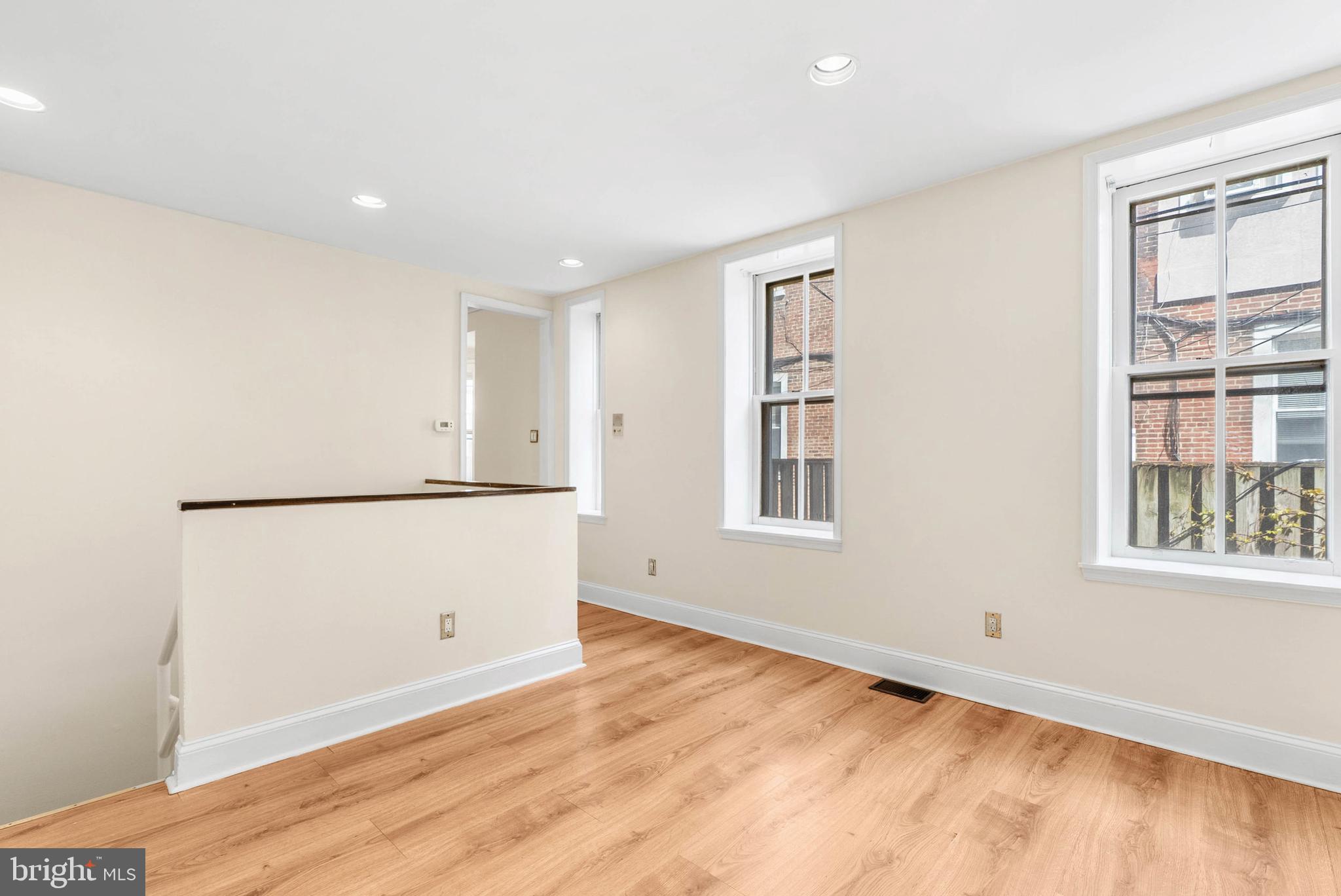 2024 Spring Garden Street, Unit 4 Philadelphia, PA 19130 - Photo 15 of 28 a view of empty room with wooden floor and window
