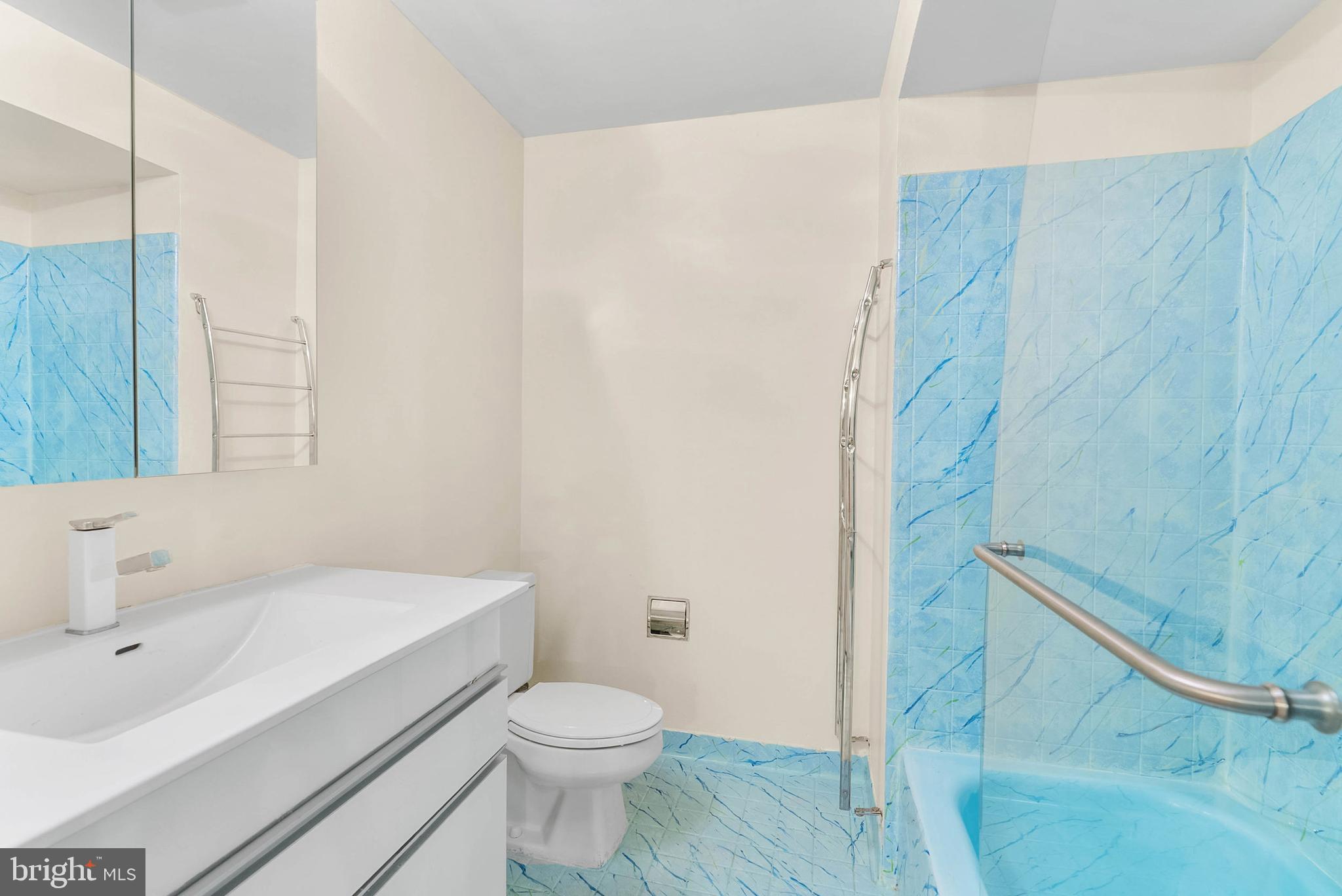 2024 Spring Garden Street, Unit 4 Philadelphia, PA 19130 - Photo 18 of 28 a bathroom with a sink a toilet and shower