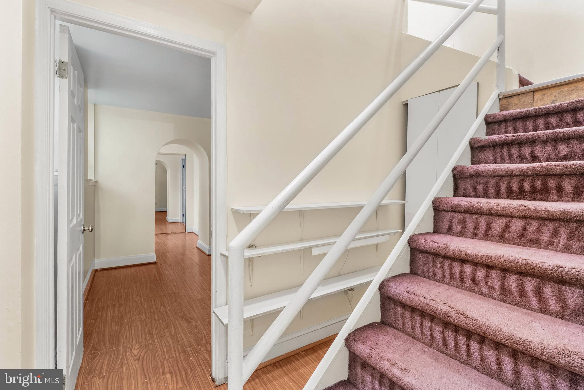 2024 Spring Garden Street, Unit 4 Philadelphia, PA 19130 - Photo 19 of 28 a view of staircase with lots of frames on wall and a window