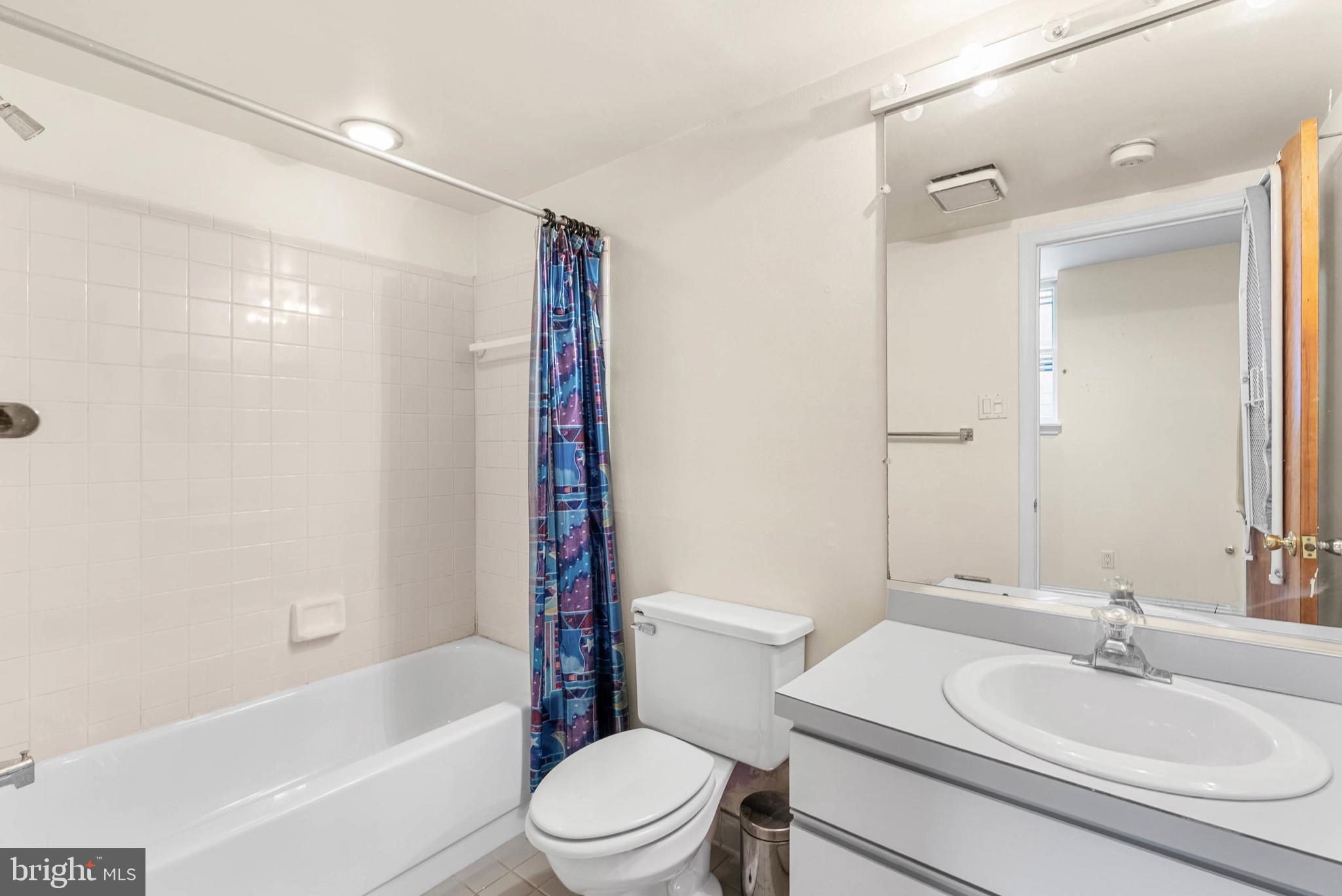 2024 Spring Garden Street, Unit 4 Philadelphia, PA 19130 - Photo 24 of 28 a bathroom with a sink toilet and shower
