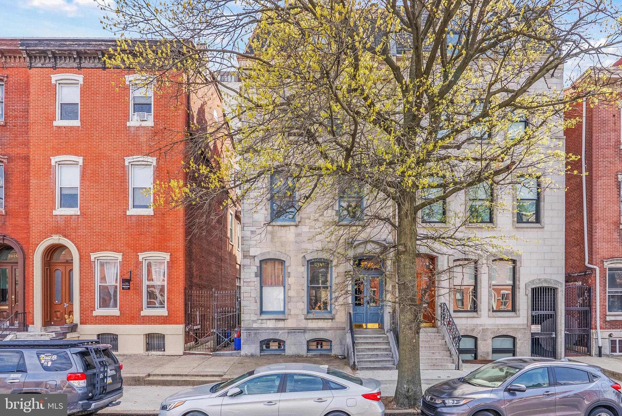 2024 Spring Garden Street, Unit 4 Philadelphia, PA 19130 - Photo 28 of 28 a front view of a building with lot of cars and trees