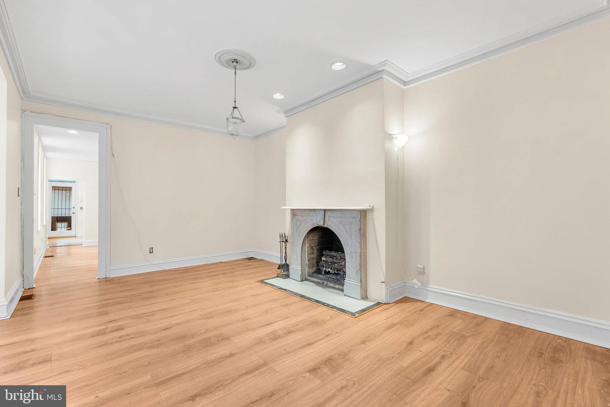 2024 Spring Garden Street, Unit 4 Philadelphia, PA 19130 - Photo 8 of 28 a view of empty room with fireplace and wooden floor