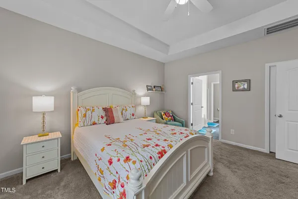 a bedroom with a bed and a couch
