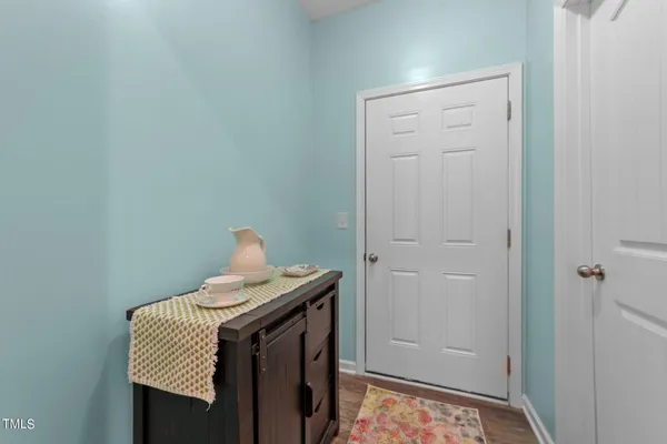 a bathroom with a sink a toilet and shower curtain