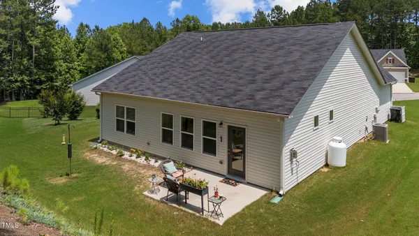 an aerial view of a house with a swimming pool