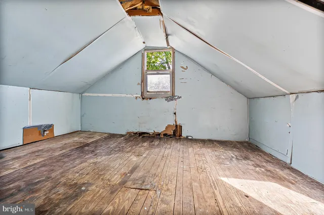 a view of a room with window and wooden floor