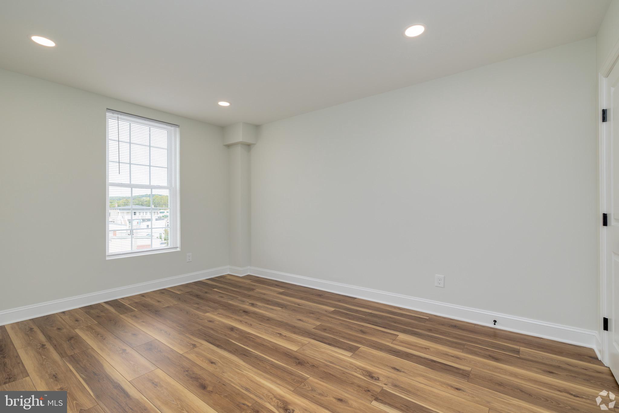 112 Washington Avenue, Unit 9 Downingtown, PA 19335 - Photo 4 of 8 an empty room with window