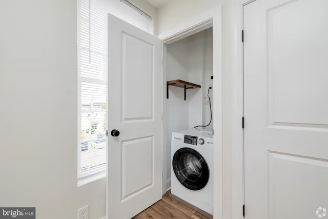 a view of bathroom with washer and dryer