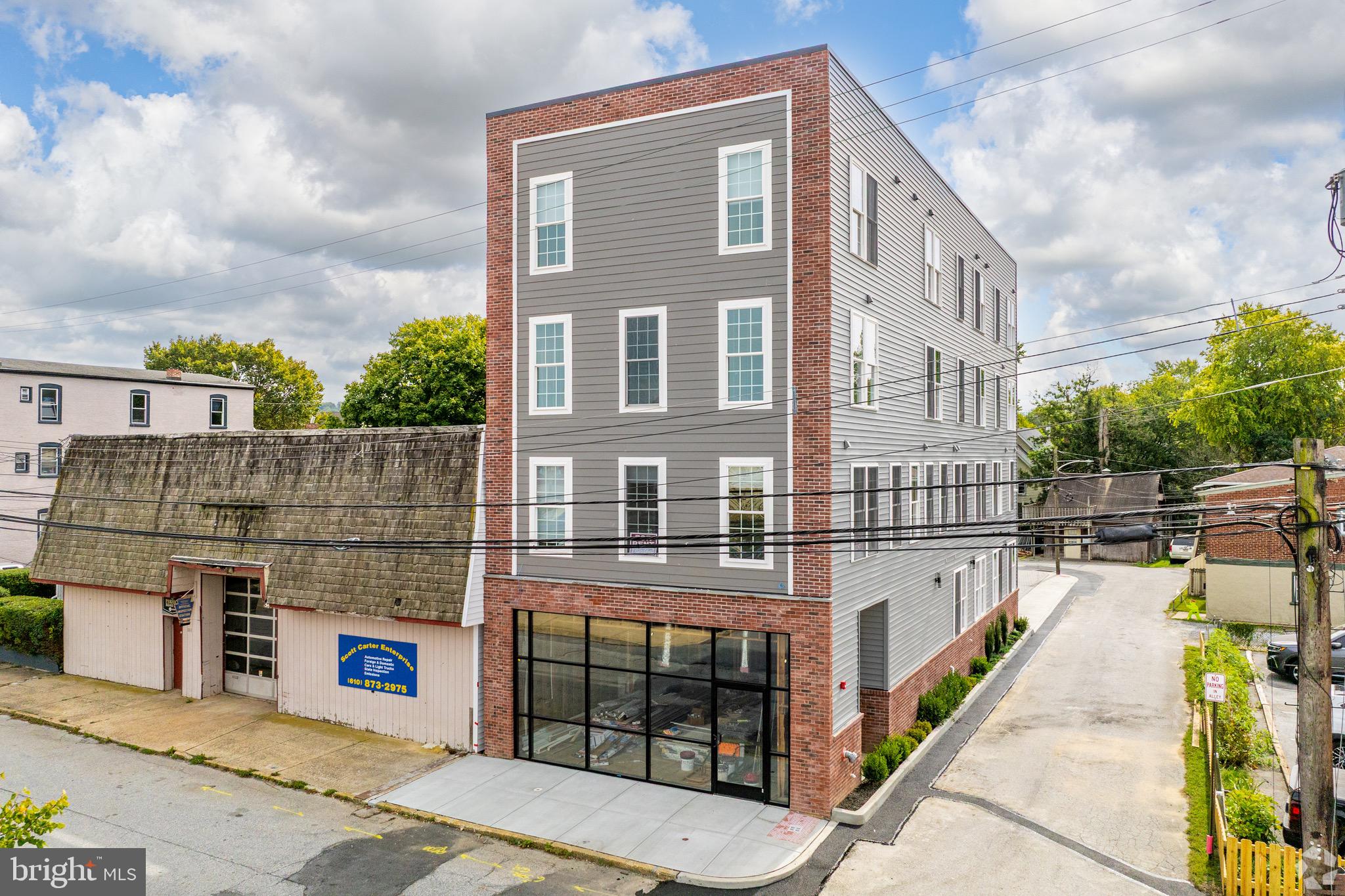 112 Washington Avenue, Unit 9 Downingtown, PA 19335 - Photo 8 of 8 a view of a brick building with many windows