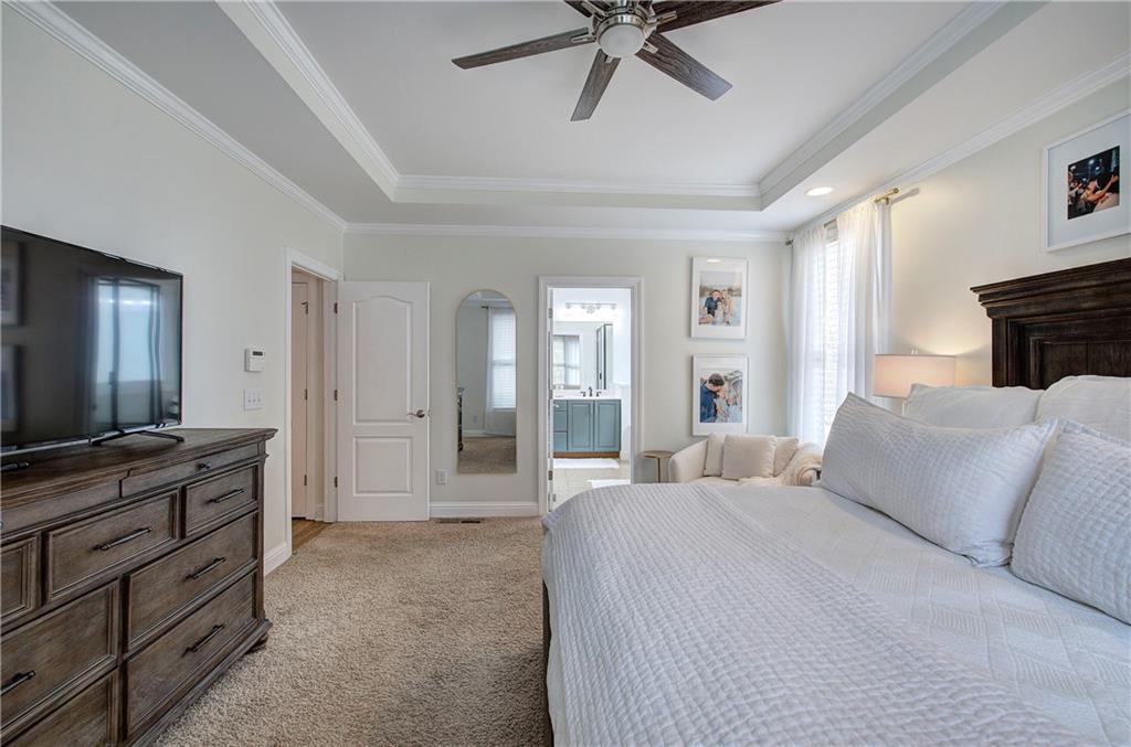 16 Thunderhawk Lane Rydal, GA 30171 - Photo 16 of 37 a spacious bedroom with a bed and a flat screen television