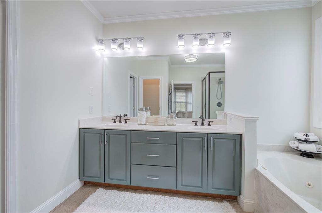 16 Thunderhawk Lane Rydal, GA 30171 - Photo 18 of 37 a bathroom with a double vanity sink and a mirror