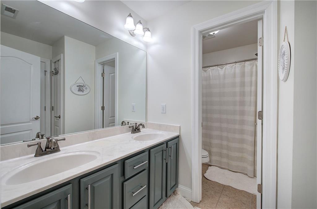 16 Thunderhawk Lane Rydal, GA 30171 - Photo 25 of 37 a bathroom with a sink double vanity and a mirror