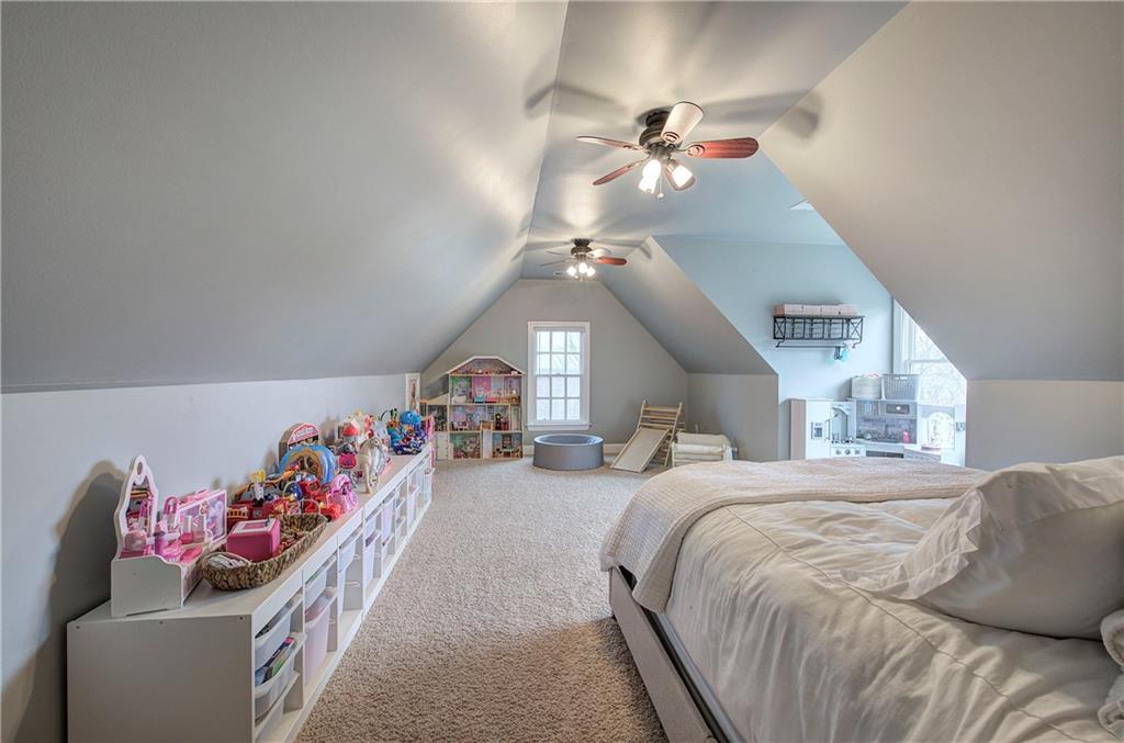 16 Thunderhawk Lane Rydal, GA 30171 - Photo 26 of 37 a bedroom with a bed and a chandelier
