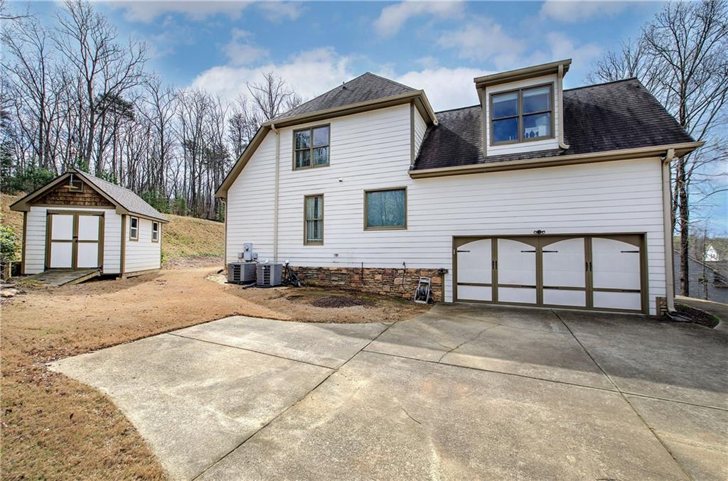 16 Thunderhawk Lane Rydal, GA 30171 - Photo 36 of 37 a view of a house with a yard and garage