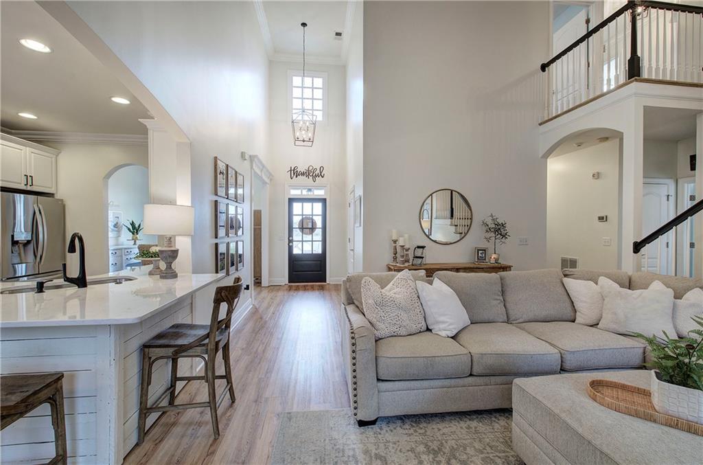 16 Thunderhawk Lane Rydal, GA 30171 - Photo 5 of 37 a living room with furniture a fireplace and a chandelier