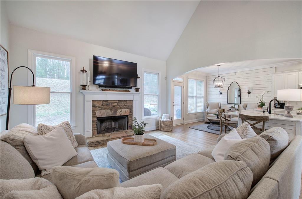 16 Thunderhawk Lane Rydal, GA 30171 - Photo 8 of 37 a living room with furniture a flat screen tv and a fireplace