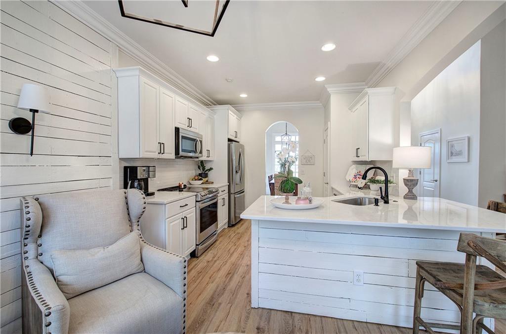 16 Thunderhawk Lane Rydal, GA 30171 - Photo 9 of 37 a kitchen with a sink stainless steel appliances and cabinets