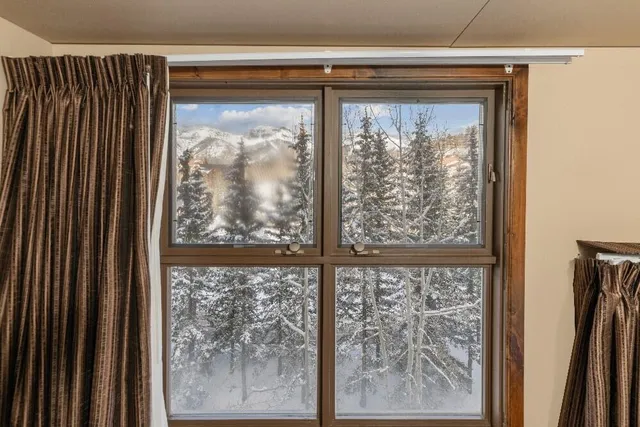 a view of a room that has a large window