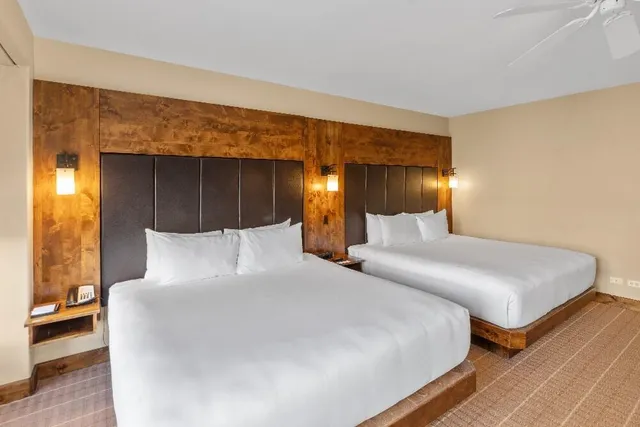 a bedroom with a bed and a night stand