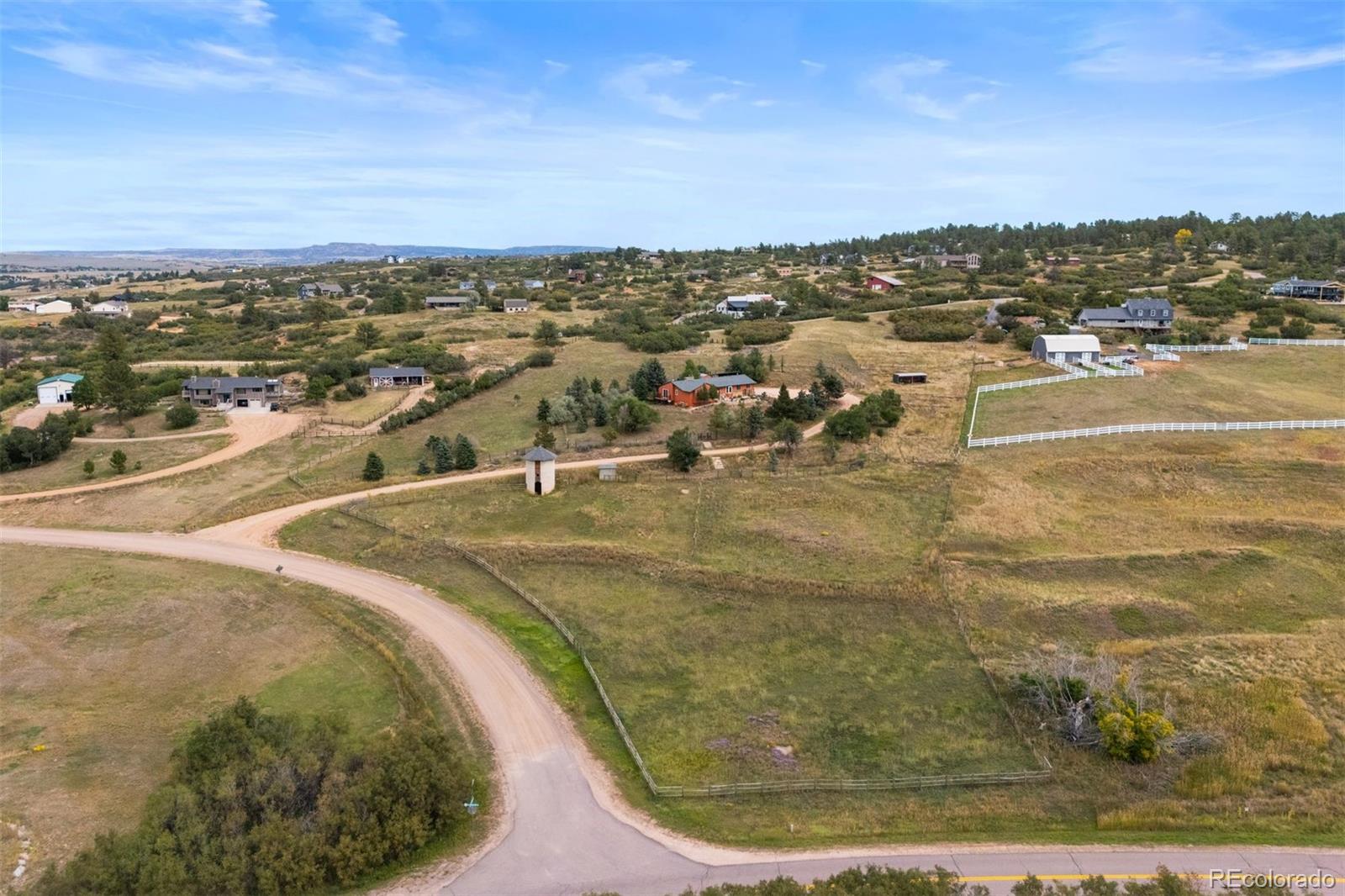 4466 West Parkridge Road Sedalia, CO 80135 - Photo 2 of 23 an aerial view of residential houses with outdoor space