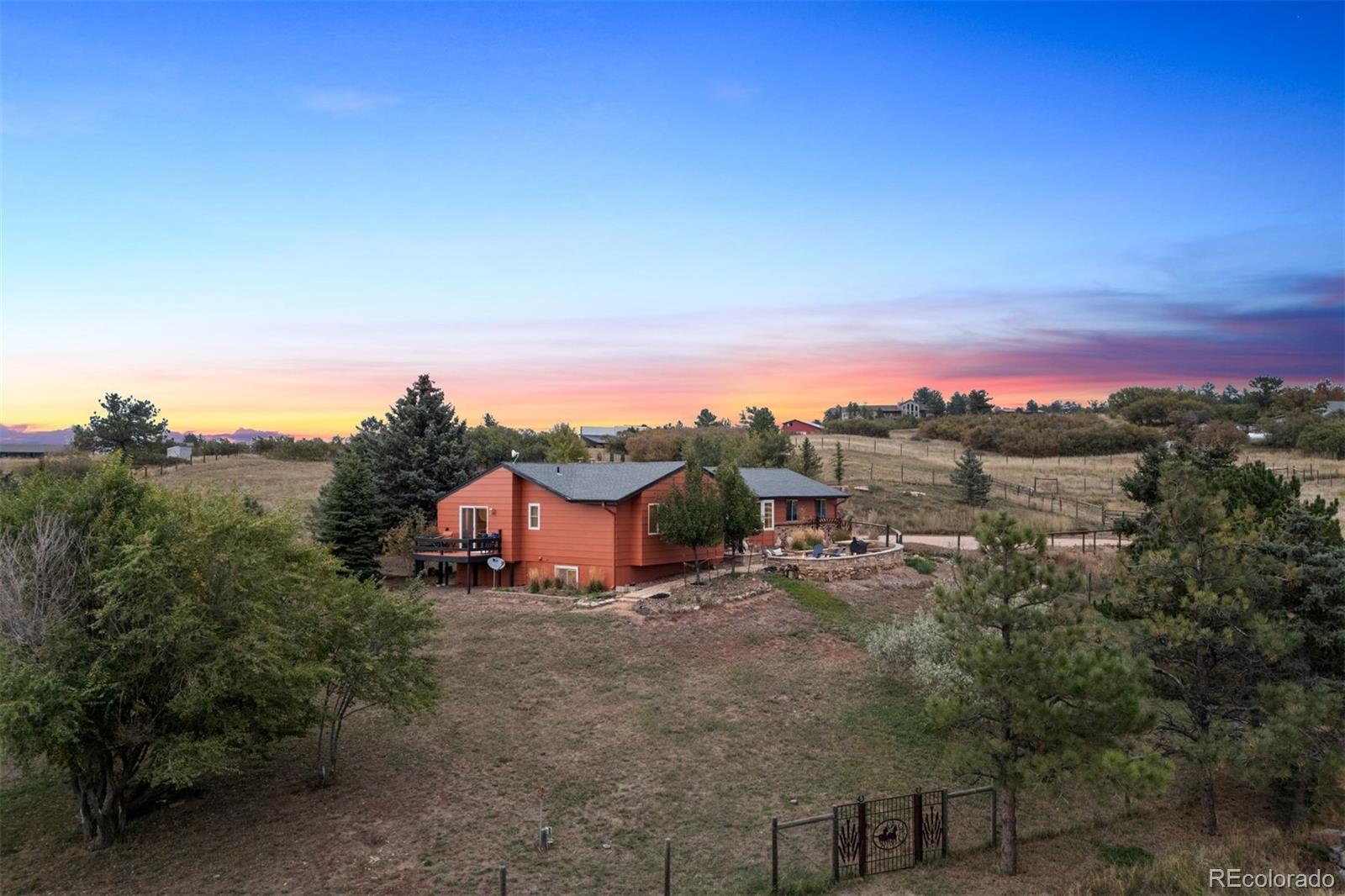 4466 West Parkridge Road Sedalia, CO 80135 - Photo 21 of 23 a view of a house with a street