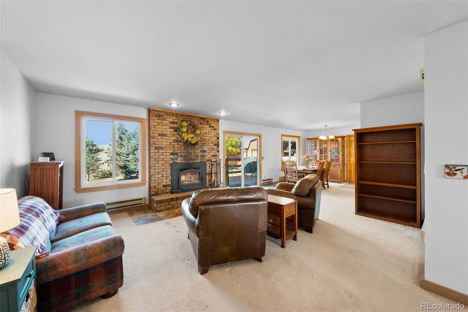 4466 West Parkridge Road Sedalia, CO 80135 - Photo 7 of 23 a living room with furniture and a large window