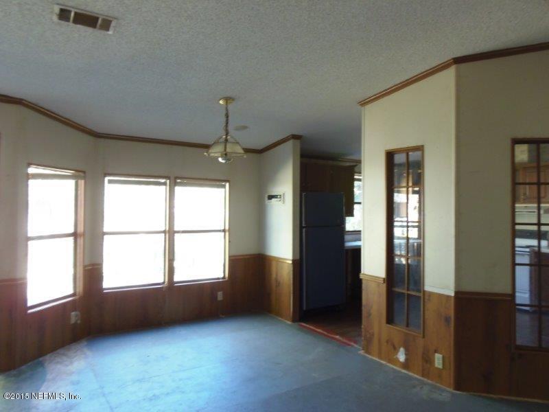 4135 Old Jennings Road Middleburg, FL 32068 - Photo 4 of 13 a view of an empty room with glass door and a window