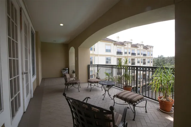 a view of a balcony with furniture