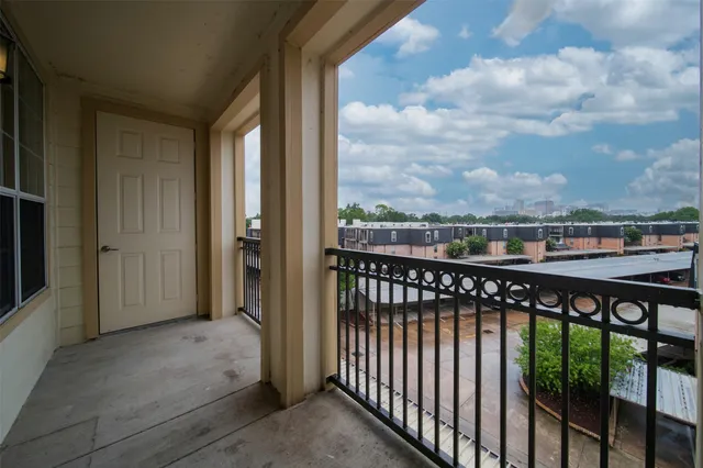 a view of a balcony with city view