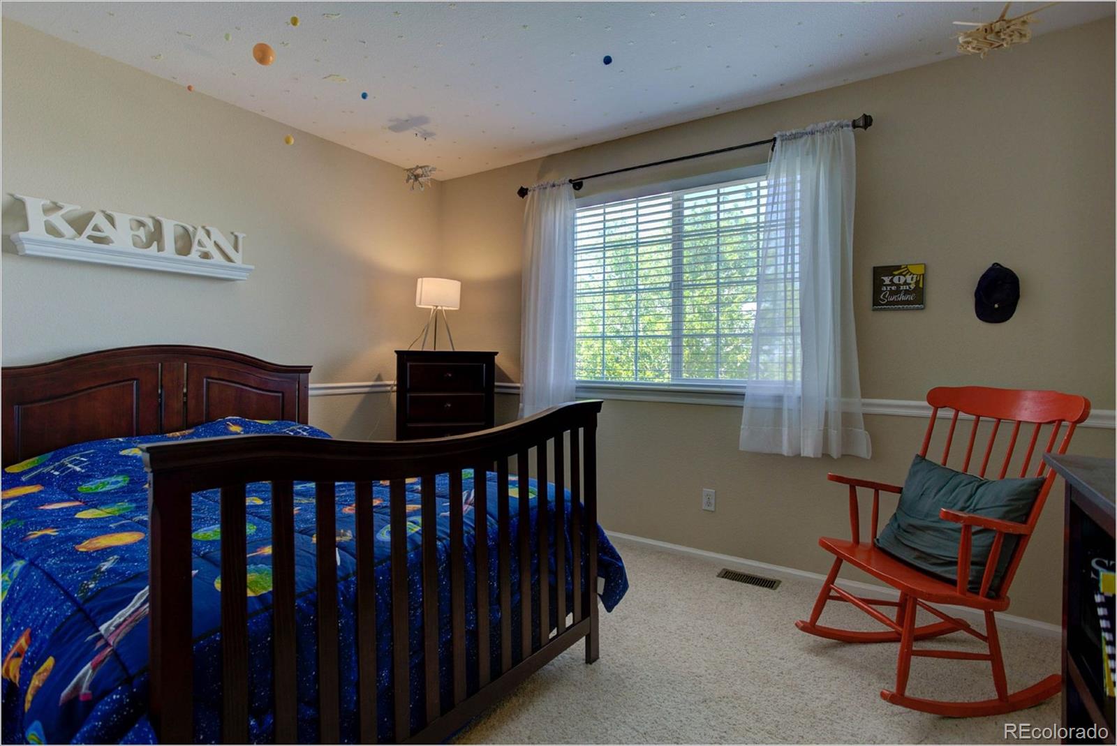 1021 Riddlewood Road Highlands Ranch, CO 80129 - Photo 11 of 29 a bedroom with furniture and a window