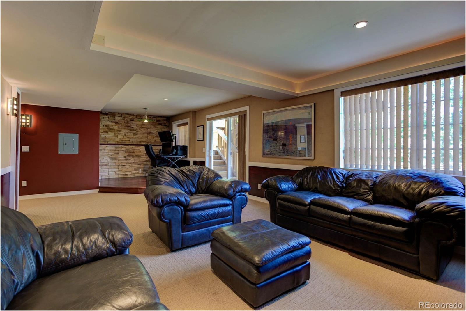 1021 Riddlewood Road Highlands Ranch, CO 80129 - Photo 18 of 29 a living room with furniture and a large window