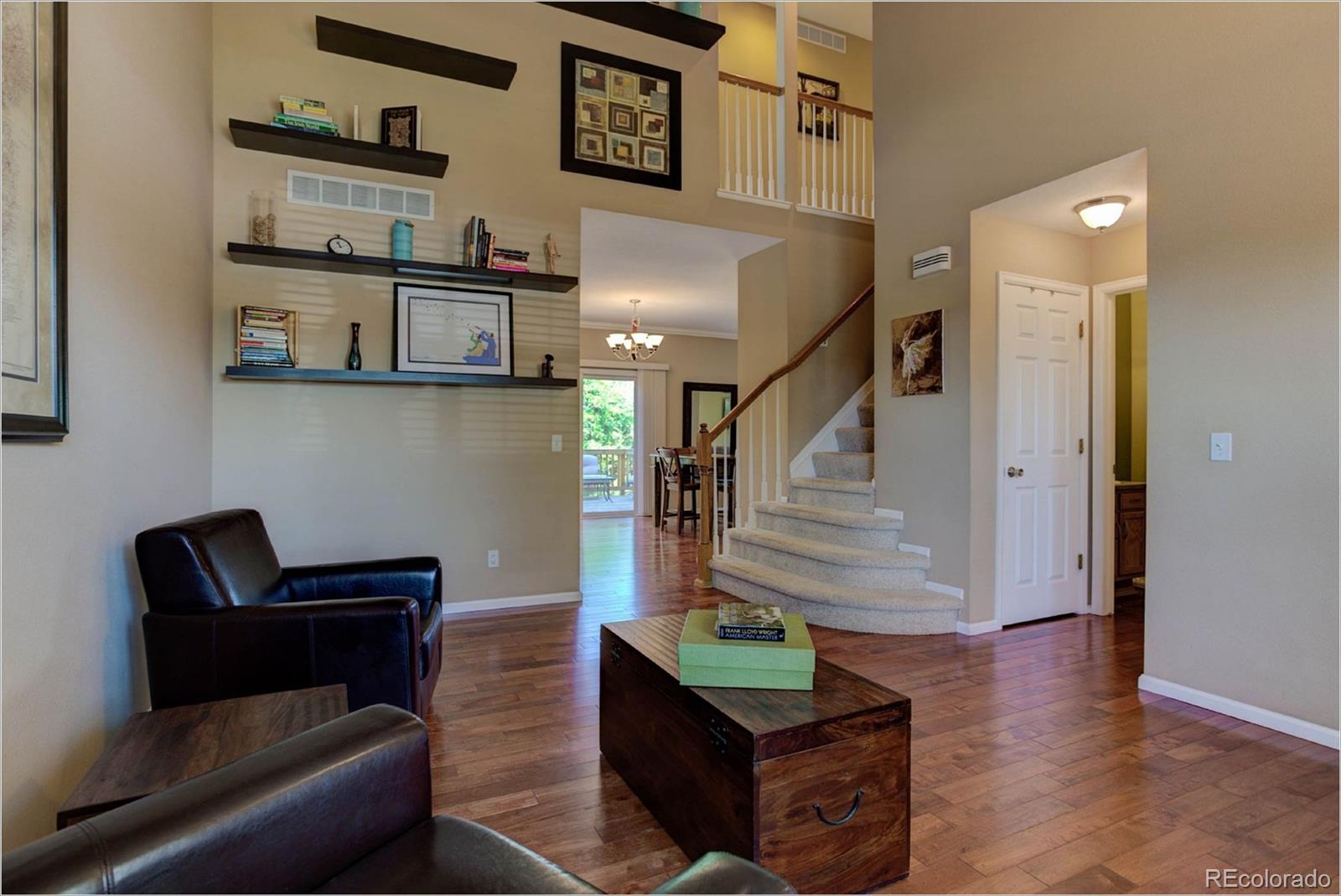 1021 Riddlewood Road Highlands Ranch, CO 80129 - Photo 2 of 29 a view of entryway and hall with wooden floor