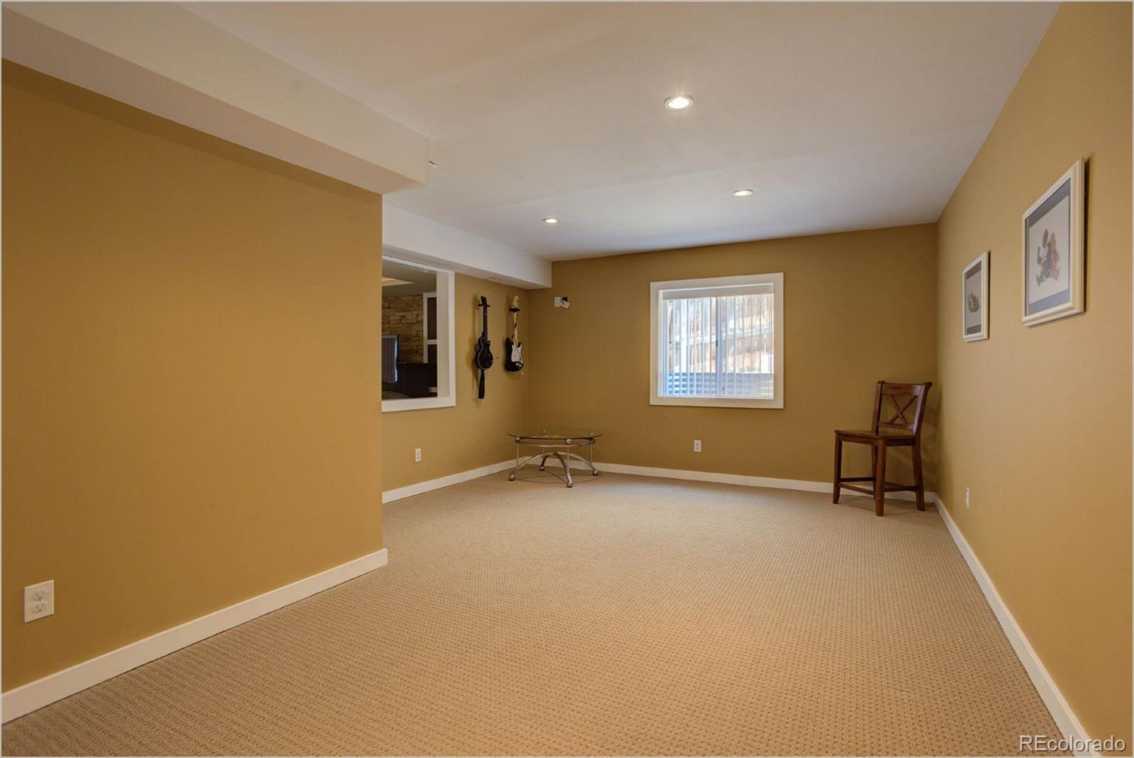 1021 Riddlewood Road Highlands Ranch, CO 80129 - Photo 21 of 29 a view of an empty room with a window